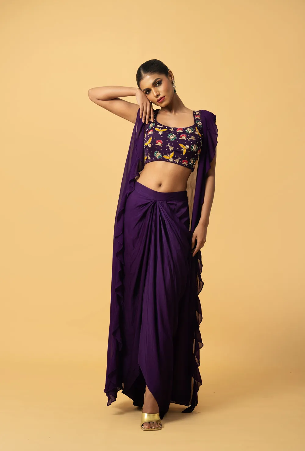 Violet Co - Ord Set With Multi Coloured Hand Embroidery On The Blouse . Blouse & Dhoti Is Of Modal Satin , Cape Is Of Georgette