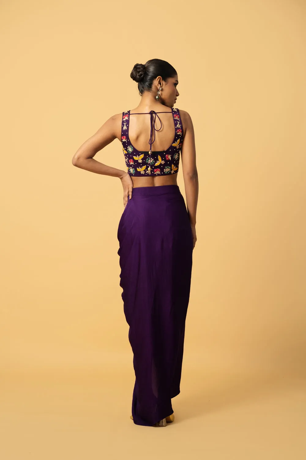 Violet Co - Ord Set With Multi Coloured Hand Embroidery On The Blouse . Blouse & Dhoti Is Of Modal Satin , Cape Is Of Georgette